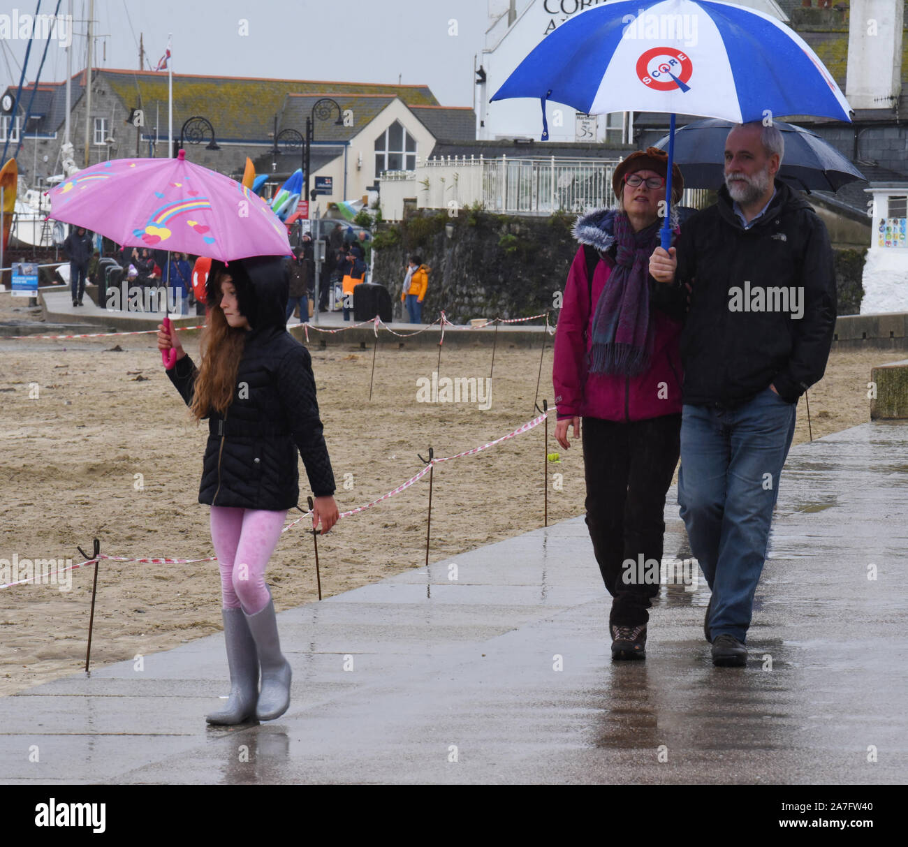 Lyme Regis, Dorset, UK.  2nd November 2019. UK Weather: Visitors look at on as a  large area of Lyme Regis' pretty sandy beach is cordoned off after the sand was washed away during heavy overnight rainfall  Credit: DWR/Alamy Live News. Stock Photo
