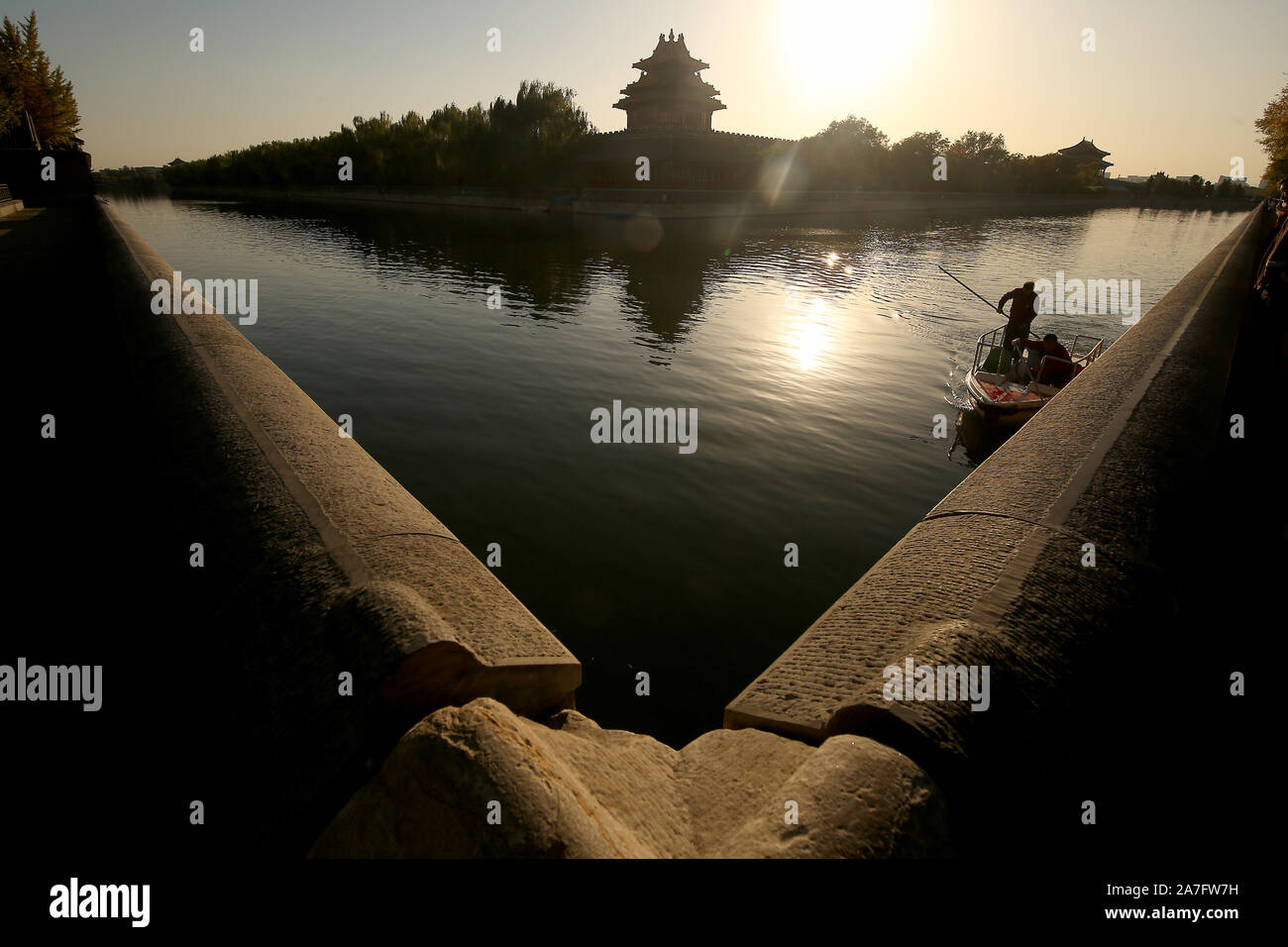 Beijing, China. 02nd Nov, 2019. Chinese workers clean the moat surrounding the Forbidden City in Beijing on Saturday, November 2, 2019. China, which relies heavily on domestic and international tourism to add to the national economy, has aggressively promoted the 'greening' and 'cleaning' of the country's top tourist destinations and UNESCO sites. Photo by Stephen Shaver/UPI Credit: UPI/Alamy Live News Stock Photo
