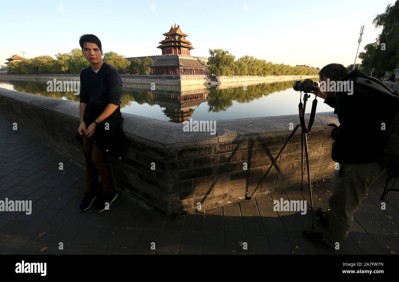 Beijing, China. 02nd Nov, 2019. Tourists visit a renovated and cleaned-up Forbidden City in Beijing on Saturday, November 2, 2019. China, which relies heavily on domestic and international tourism to add to the national economy, has aggressively promoted the 'greening' and 'cleaning' of the country's top tourist destinations and UNESCO sites. Photo by Stephen Shaver/UPI Credit: UPI/Alamy Live News Stock Photo