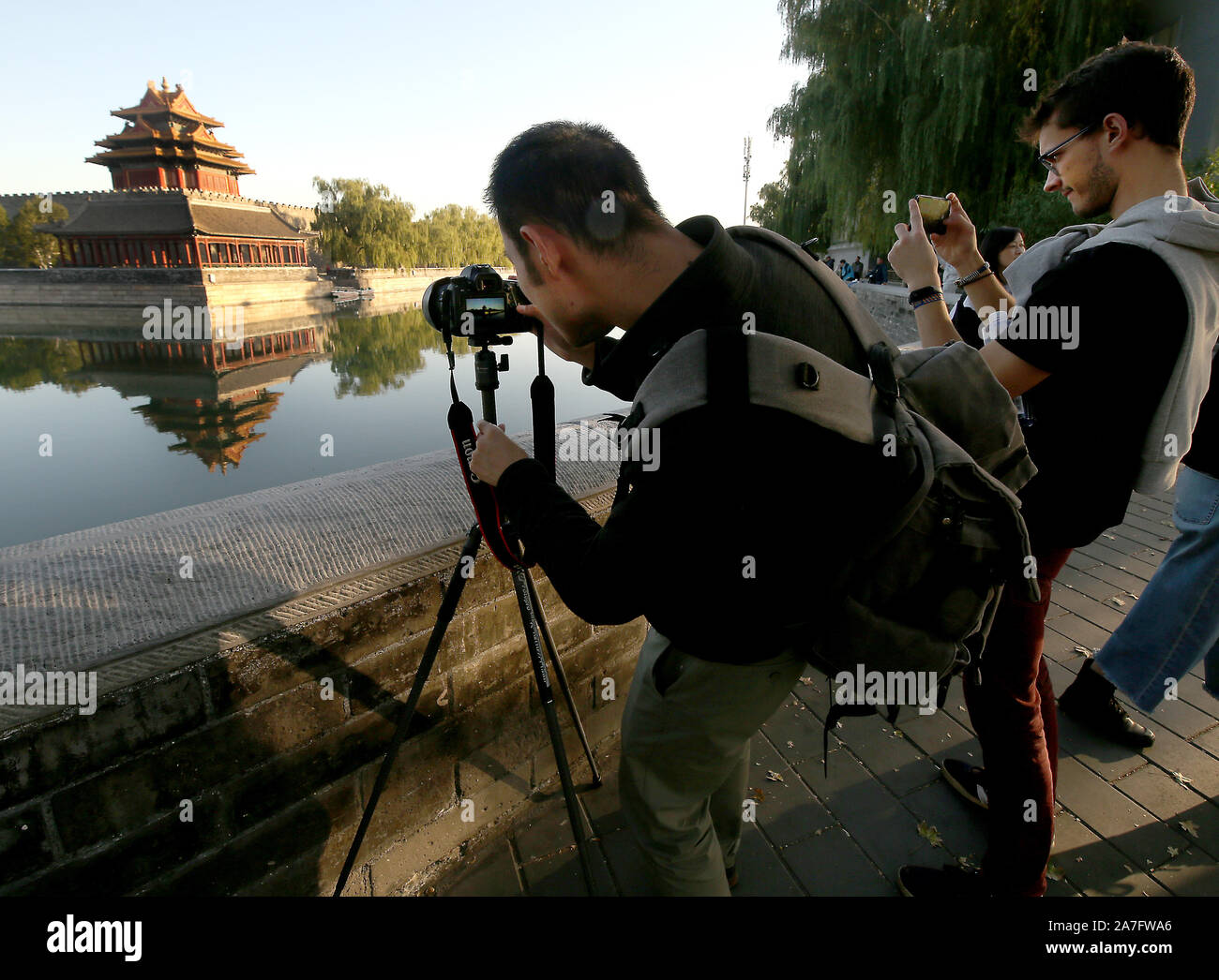 Beijing, China. 02nd Nov, 2019. Tourists visit a renovated and cleaned-up Forbidden City in Beijing on Saturday, November 2, 2019. China, which relies heavily on domestic and international tourism to add to the national economy, has aggressively promoted the 'greening' and 'cleaning' of the country's top tourist destinations and UNESCO sites. Photo by Stephen Shaver/UPI Credit: UPI/Alamy Live News Stock Photo