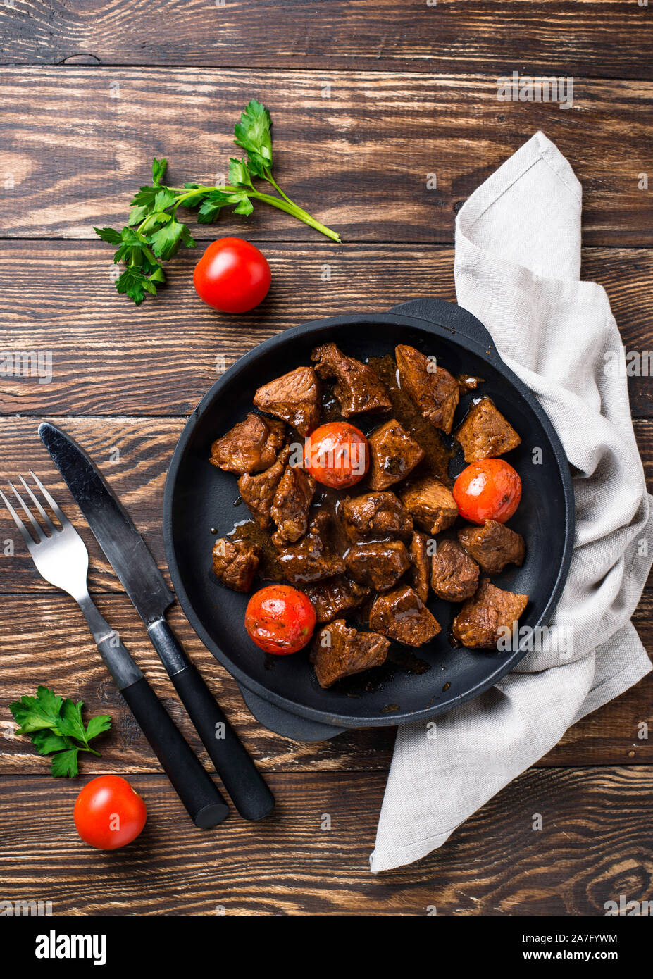 Roasted or stewed beef meat with tomato Stock Photo