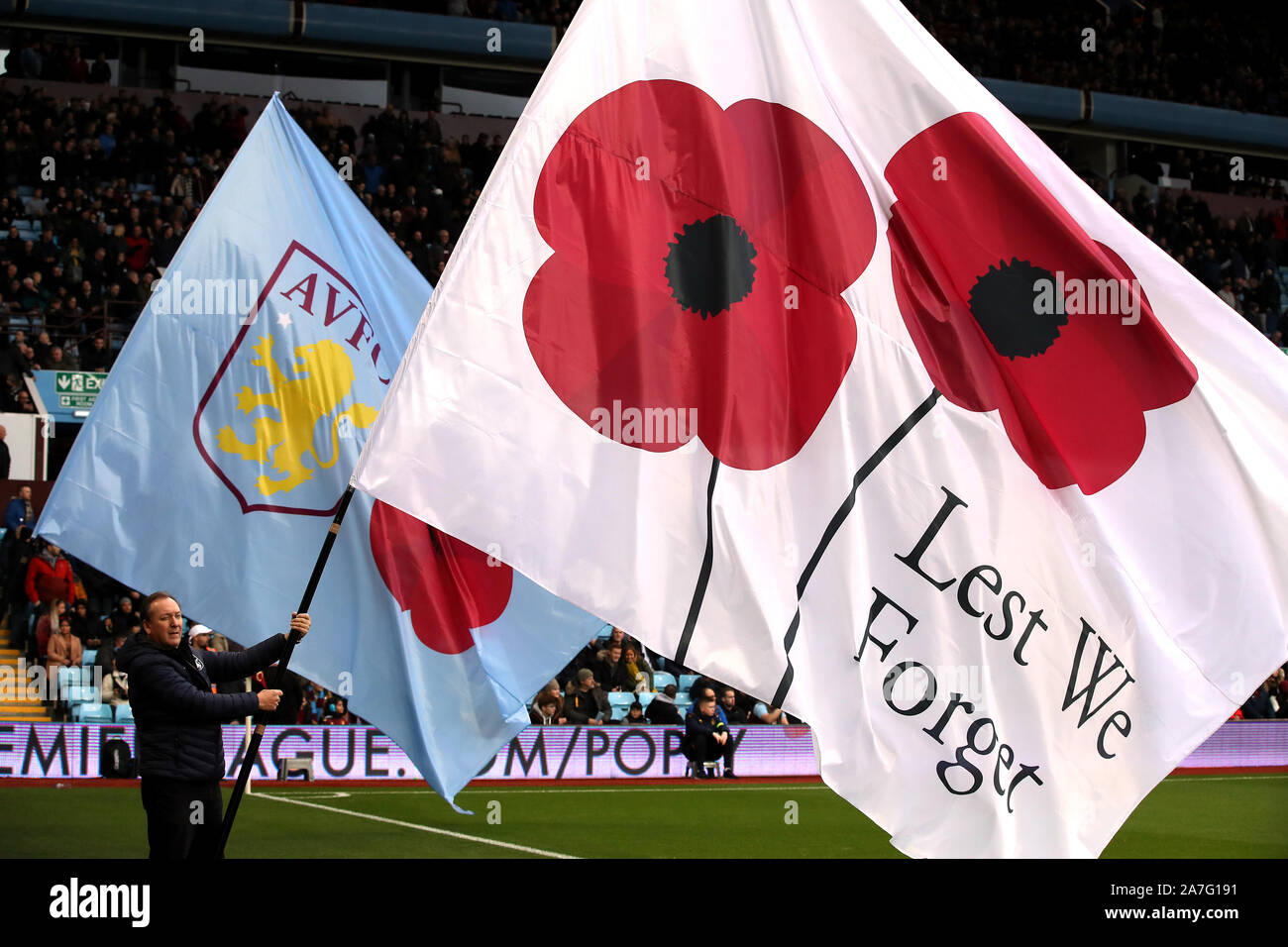 Lest we forget flags are waved during the Premiership match at Villa Park, Birmingham. Stock Photo