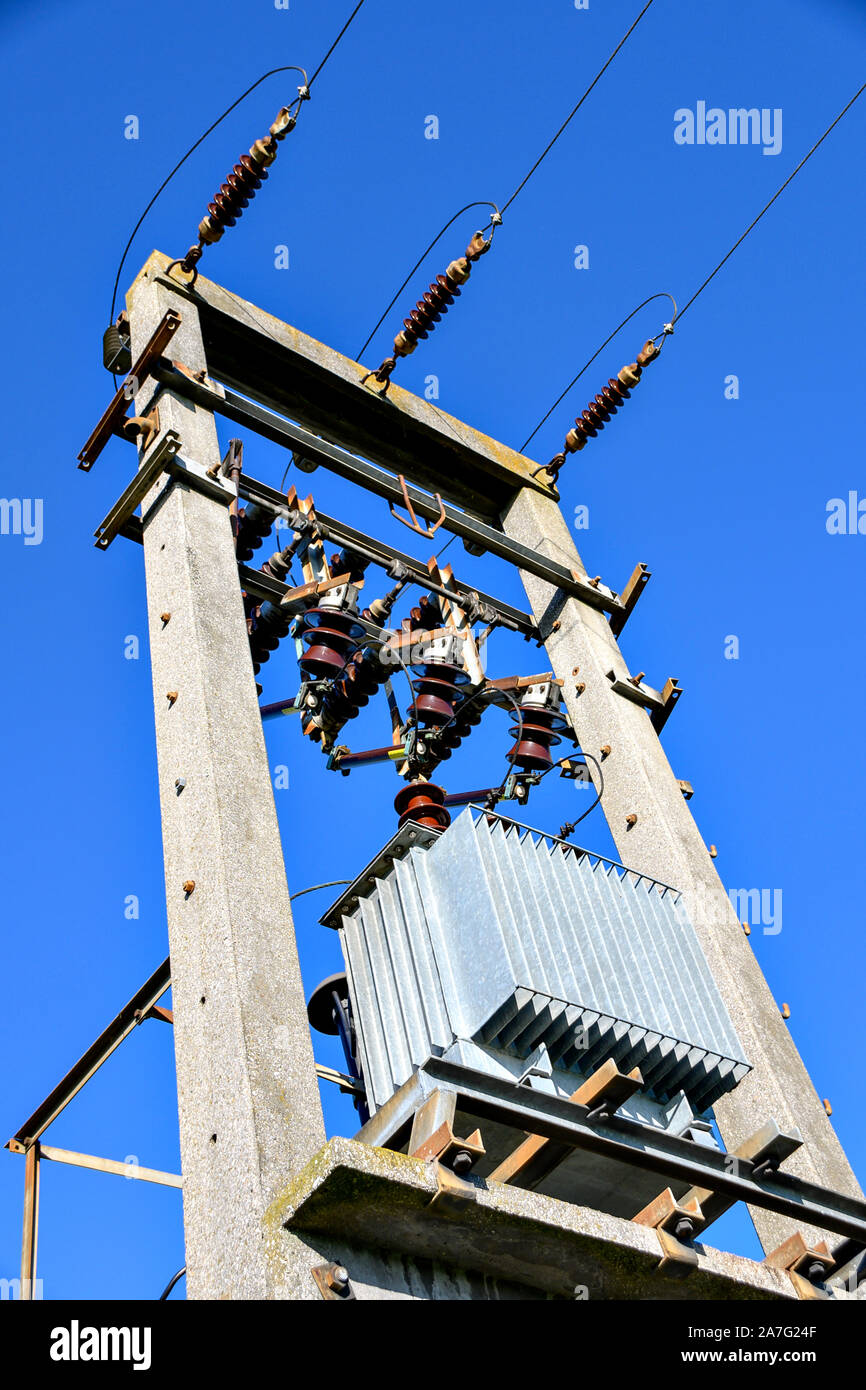transformer mounted on a transmission tower Stock Photo