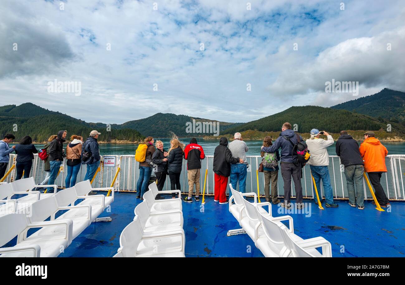 Passengers on deck of a ferry in the fjord, ferry connection Wellington Picton, Queen Charlotte Sound, South Island, New Zealand Stock Photo