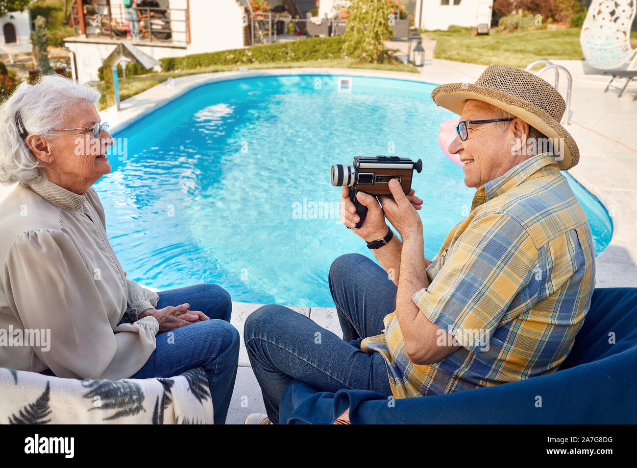 Happy senior couple spending time together and captures with a camera at holiday Stock Photo