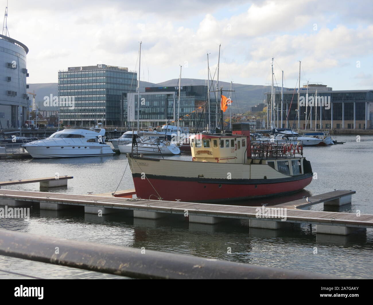 The redeveloped waterfront in Belfast's Titanic Quarter is an attractive area to walk round with boats moored at the jetties and plenty of restaurants. Stock Photo