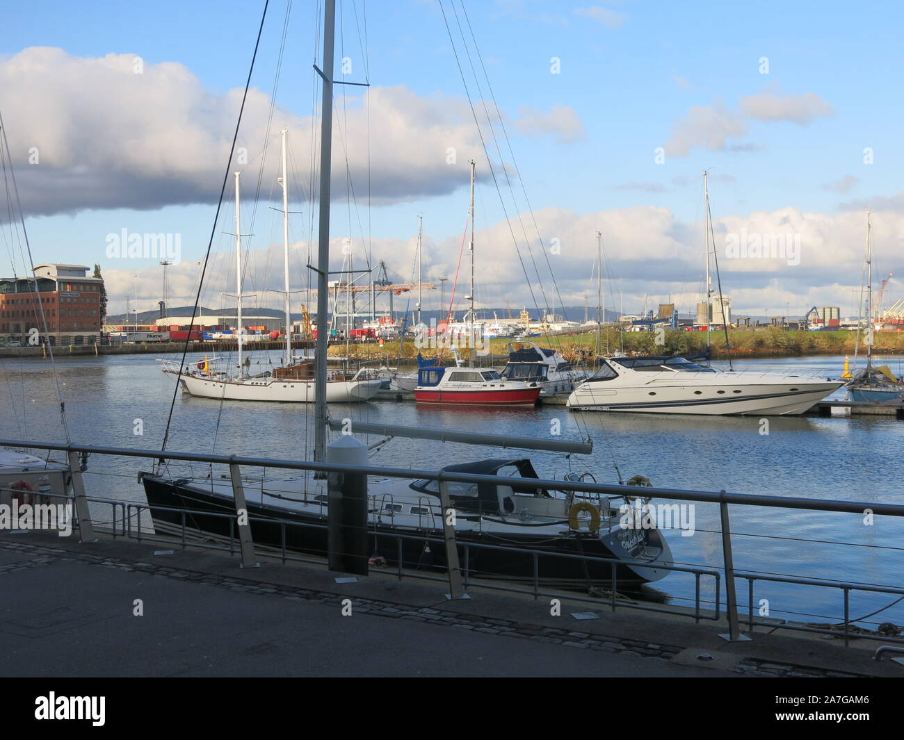 The redeveloped waterfront in Belfast's Titanic Quarter is an attractive area to walk round with boats moored at the jetties and plenty of restaurants. Stock Photo