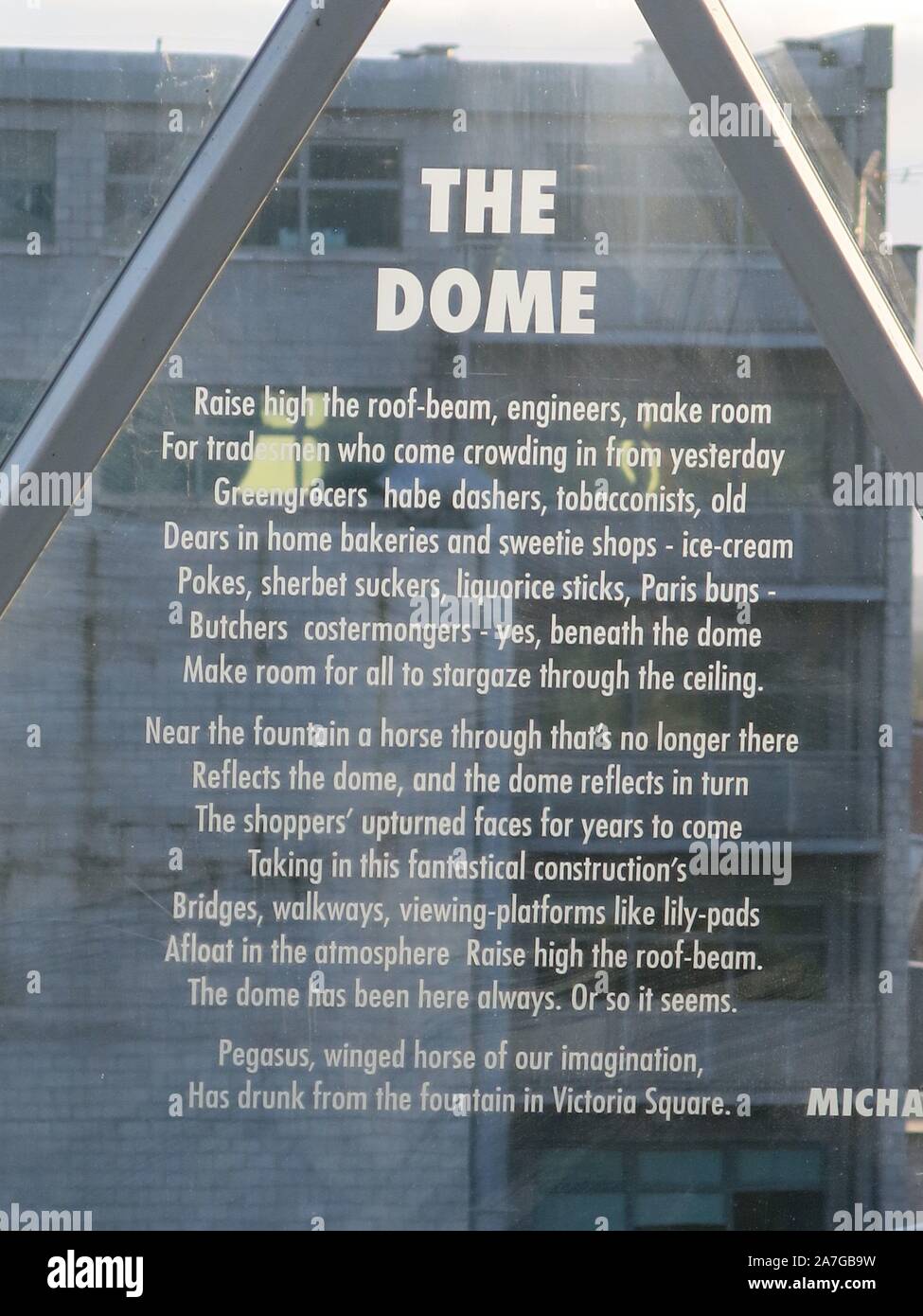 An inscription called 'The Dome' by Michael Longley is engraved in one of the panels of the geodesic dome at Belfast's Victoria Gate shopping centre. Stock Photo