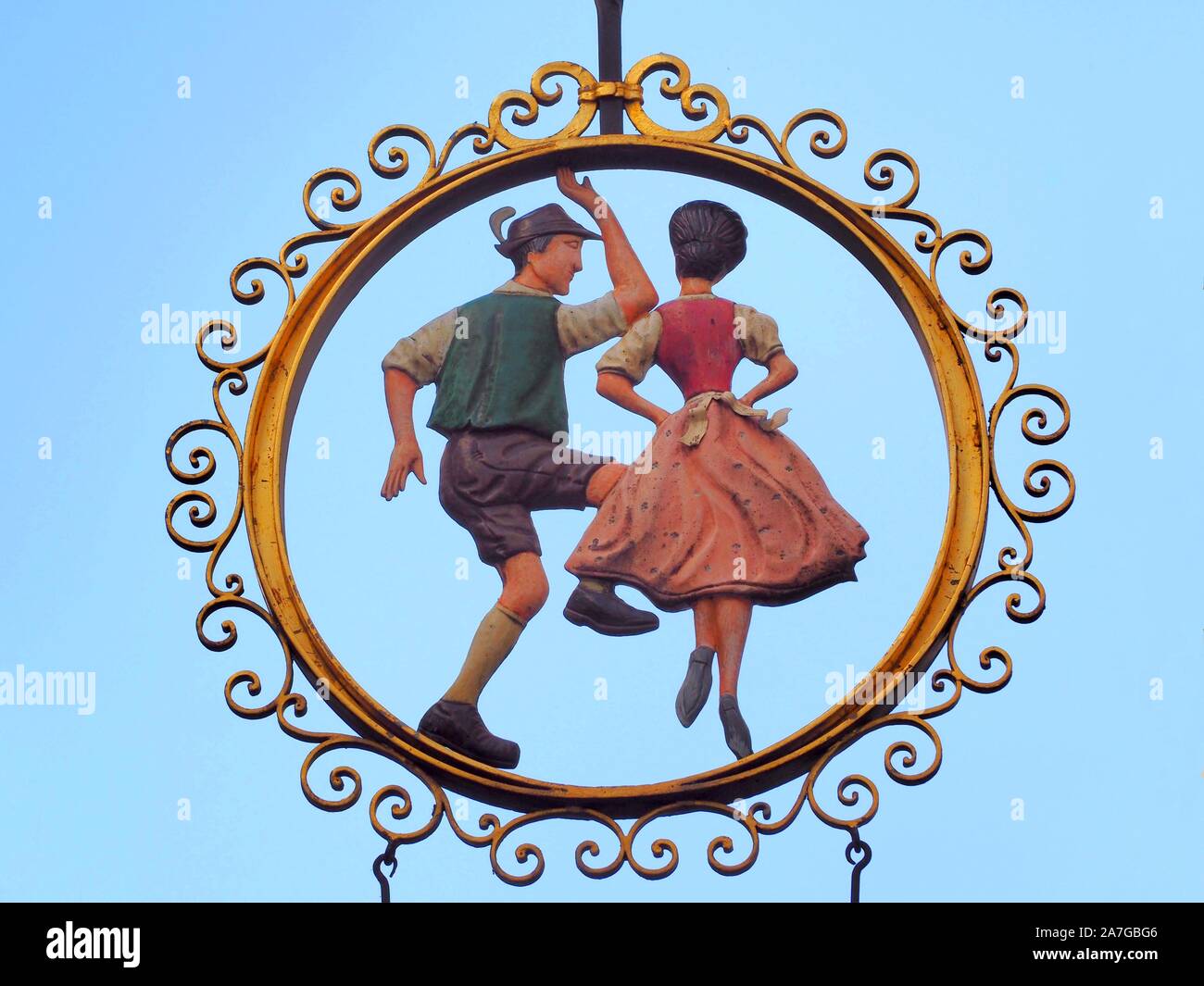 Iconic sign of an Austrian traditional dancing couple in Salzburg ...