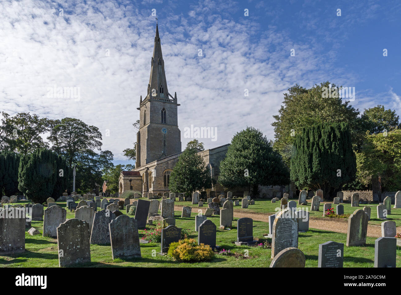 The parish church of St Peter in the village of Sharnbrook, Bedfordshire, UK; earliest parts date from 13th century with a 15th century spire. Stock Photo
