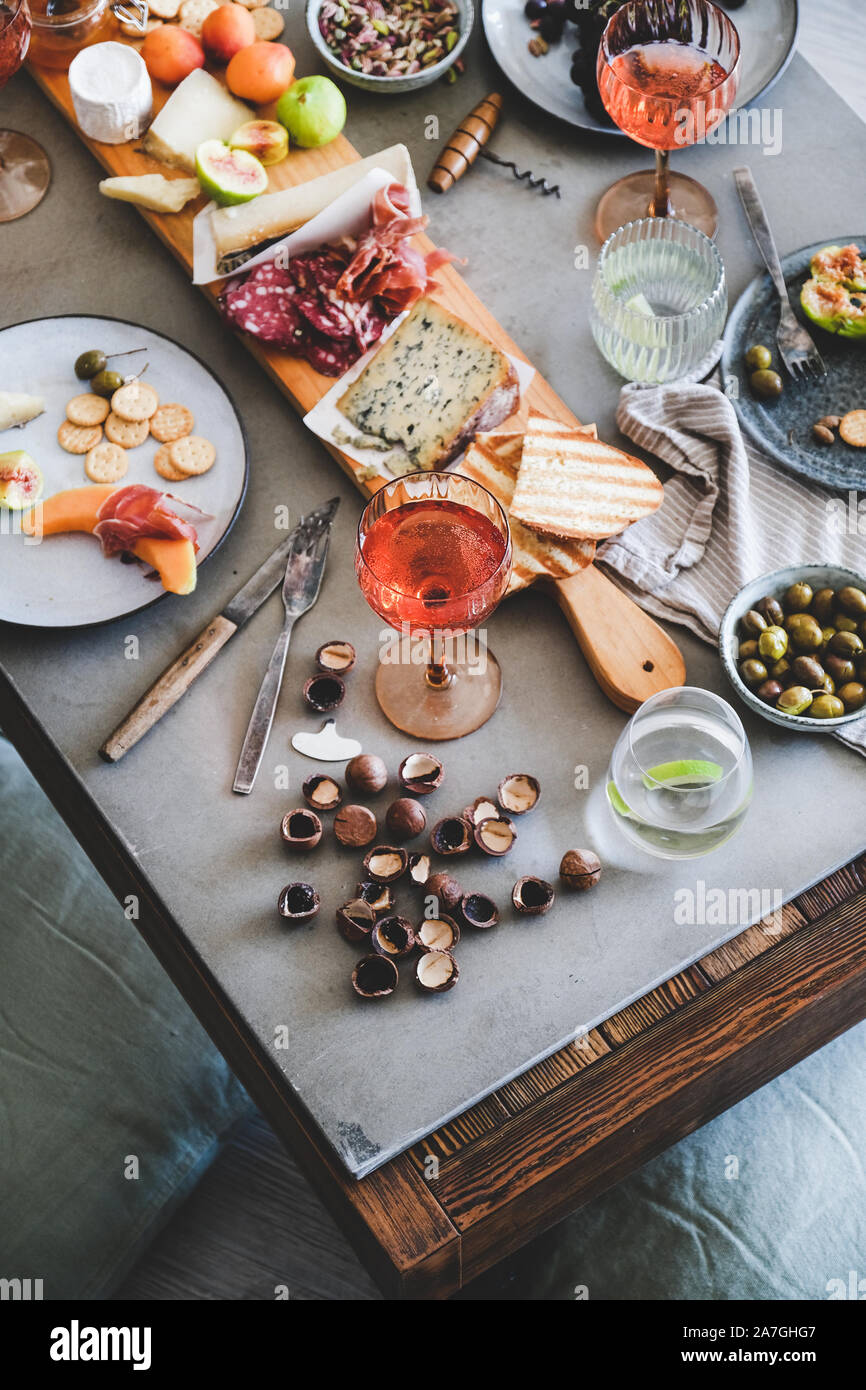 Picnic with rose wine, cheese, charcuterie, appetizers and fresh fruits