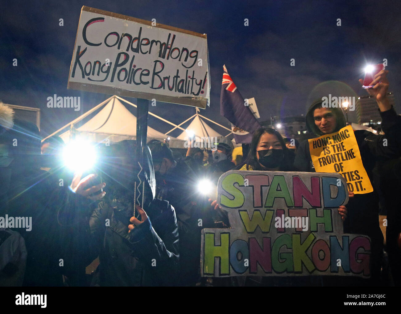 Hong Kong pro-democracy protesters taking part in a Hong Kong solidarity rally in Trafalgar Square, London. Stock Photo