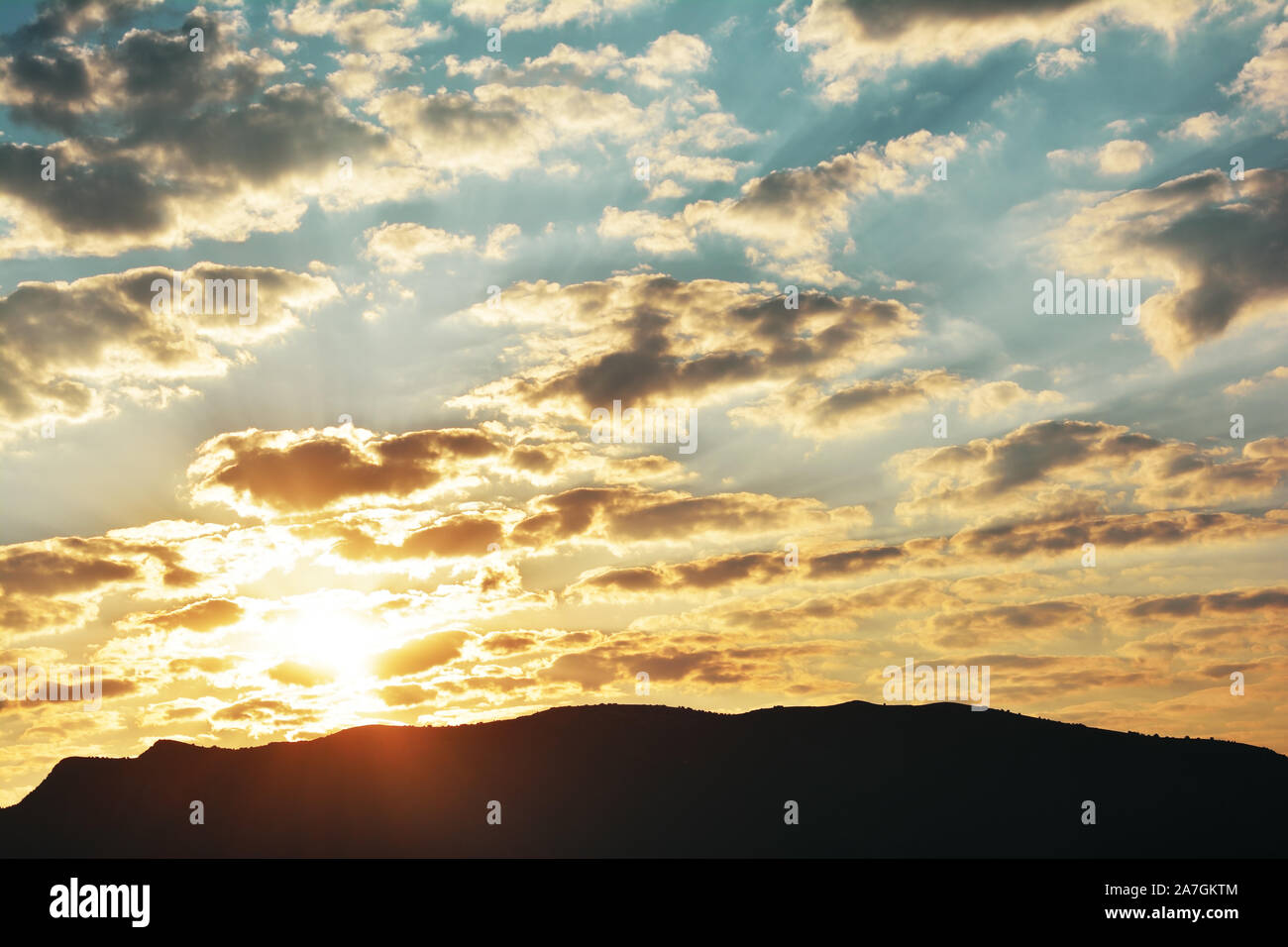 Sunrise with clouds over the mountain Stock Photo - Alamy