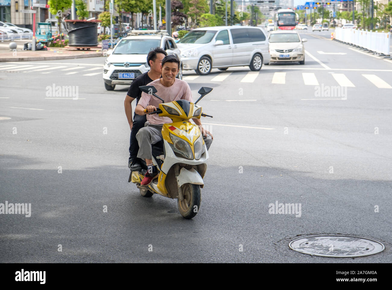 Cyclists and moped riders hi-res stock photography and images - Alamy