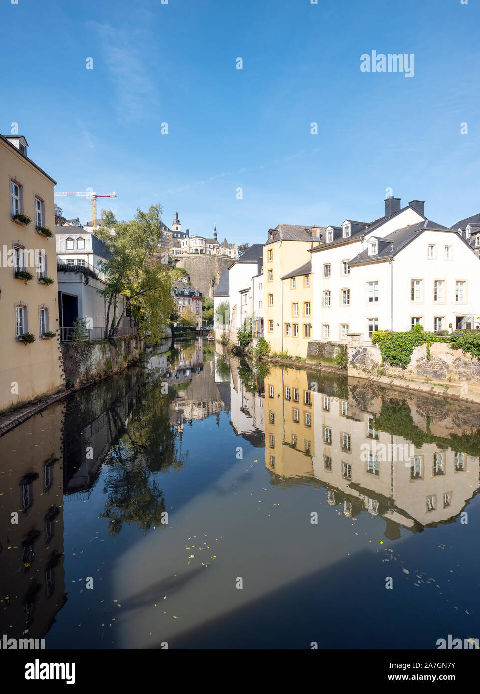 old houses reflect in water of river alzette in grund or lower town of luxembourg city Stock Photo