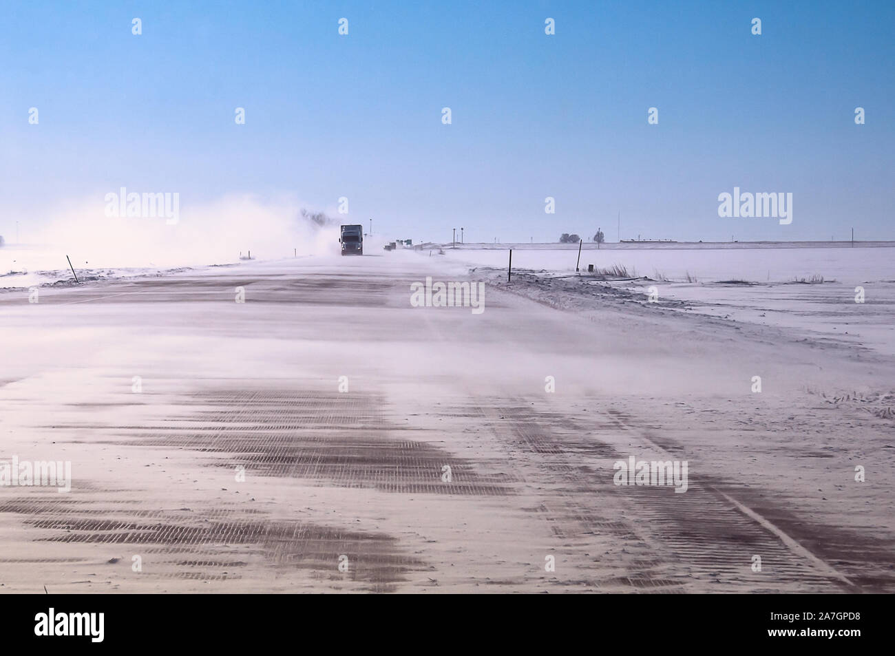 Winter wind and blowing snow on a major highway Stock Photo