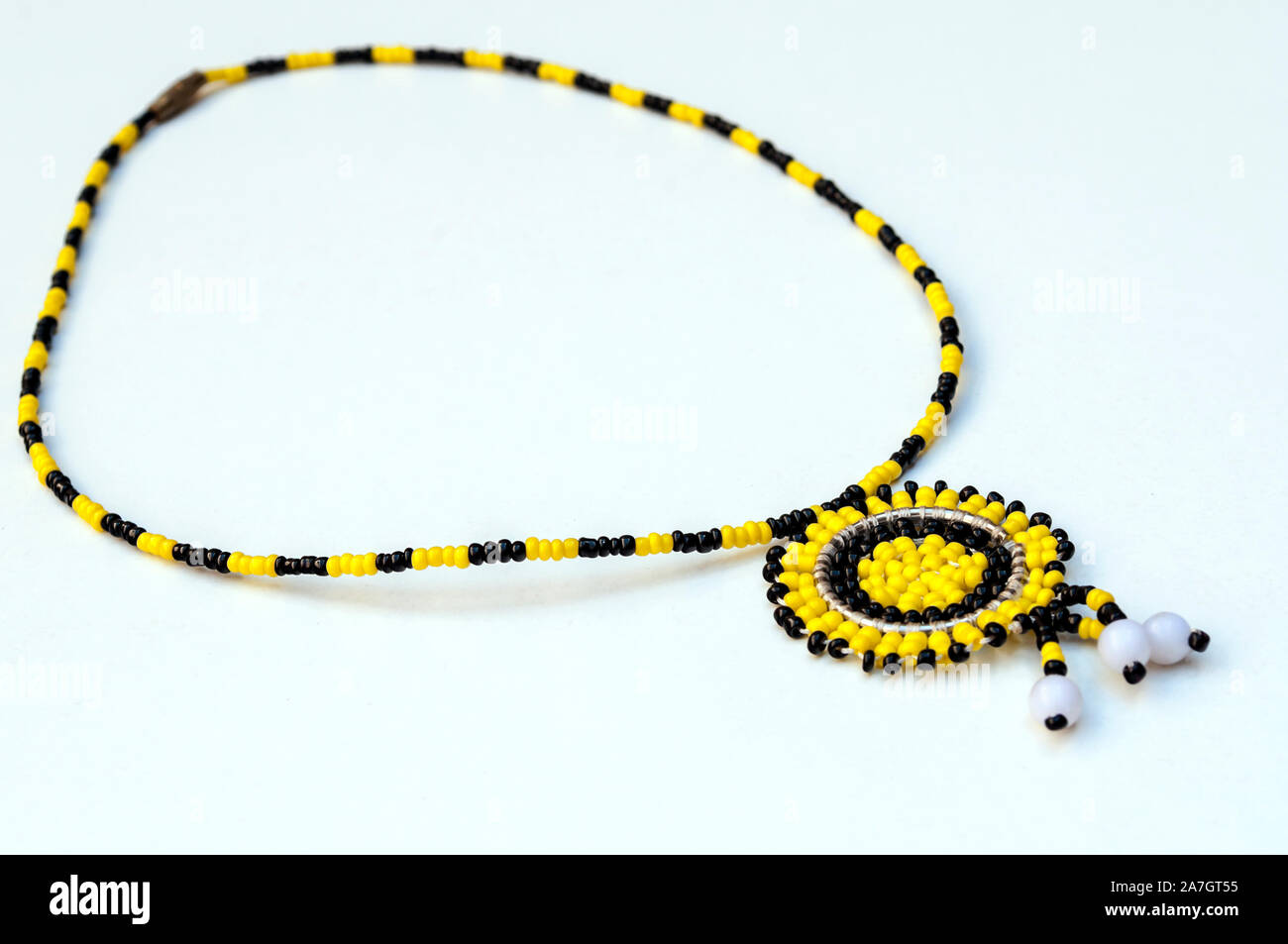 Masai necklaces surrounded by white background Stock Photo - Alamy