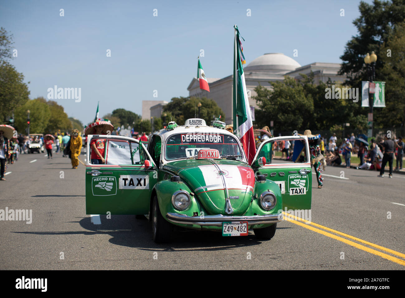 Washington DC, USA - September 21, 2019: The Fiesta DC, Mexican Beetle Taxi, carrying mexican flags during the parade Stock Photo