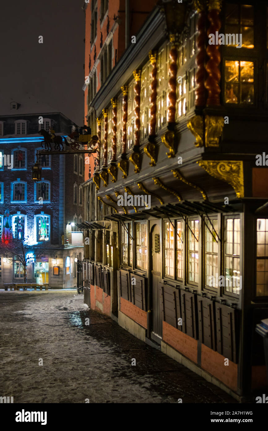 Snowy empty street at night in Aachen, Germany Stock Photo
