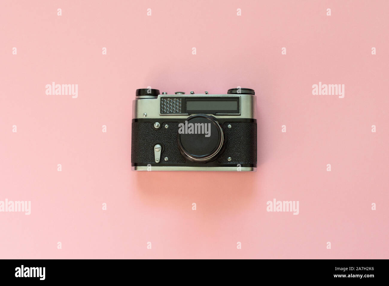 Retro camera closeup isolated on a pink background Stock Photo