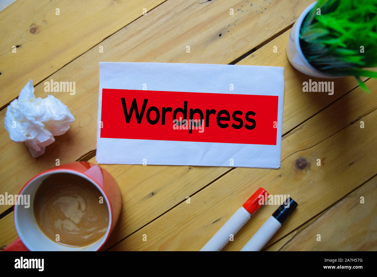 Wordpress write on the tissue with wooden table background Stock Photo