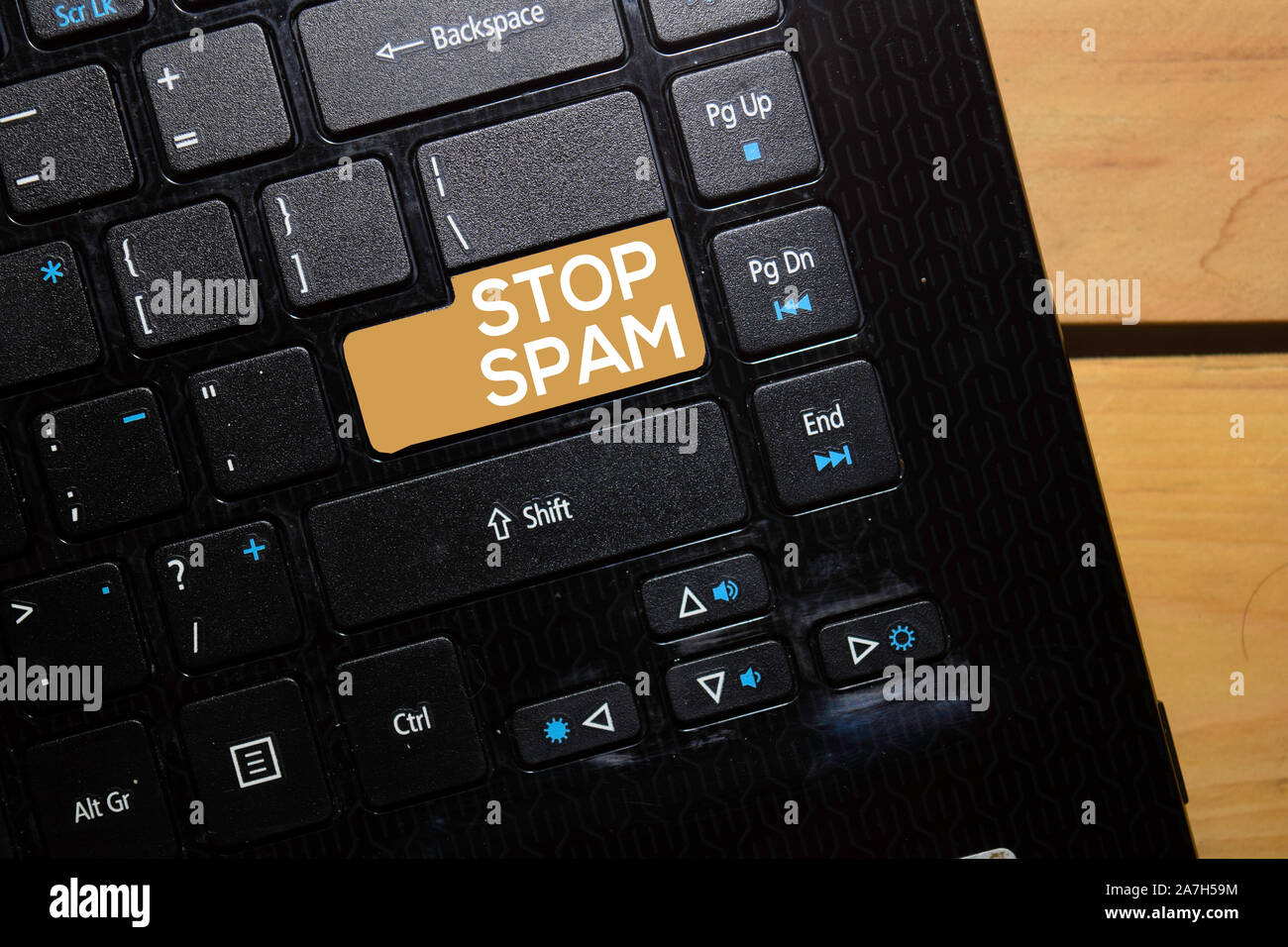 Stop Spam write on keyboard isolated on laptop background Stock Photo