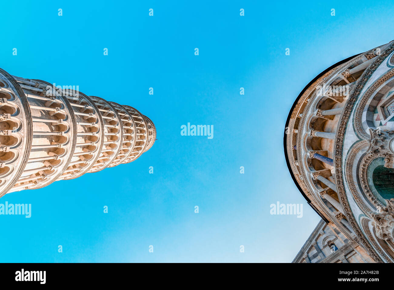 pisa, Italy - August 28, 2018: Battistero di San Giovanni and Leaning Tower in Piazza dei Miracoli Stock Photo