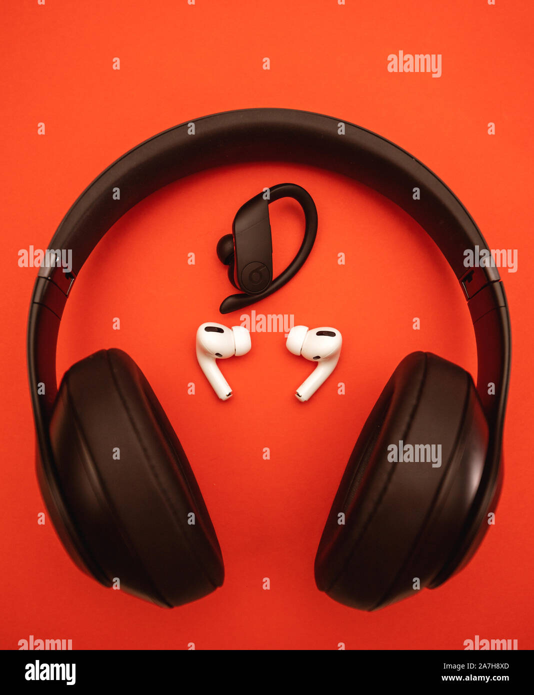 Paris, France - Oct 30, 2019: Powerbeats Pro by Dr Dre and Beats Studio Wireless next to New Apple Computers AirPods Pro headphones with Active Noise Stock Photo