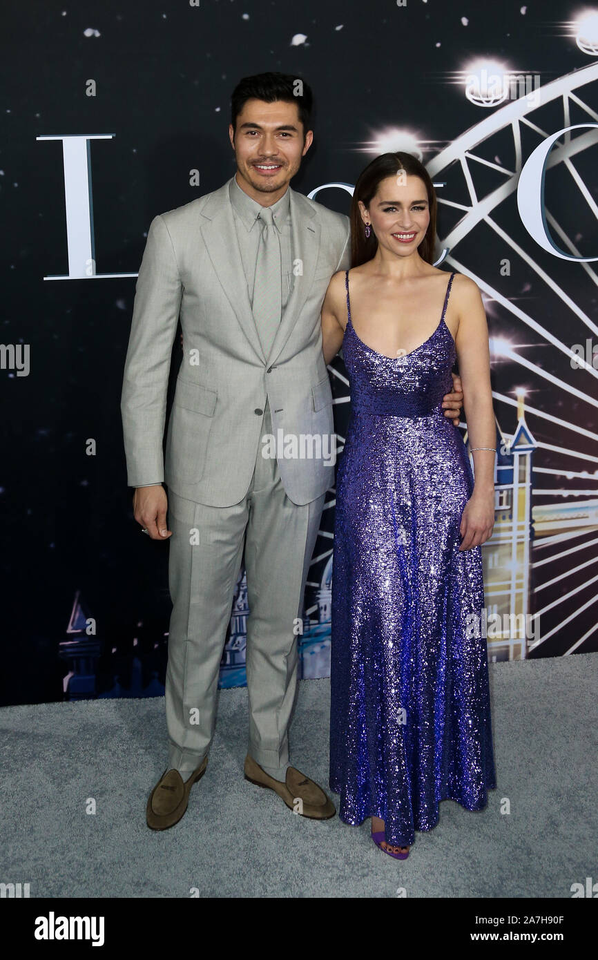 Henry Golding (L) and Emilia Clarke attend the premiere of 'Last Christmas' at AMC Lincoln Square on October 29, 2019 in New York City. Stock Photo