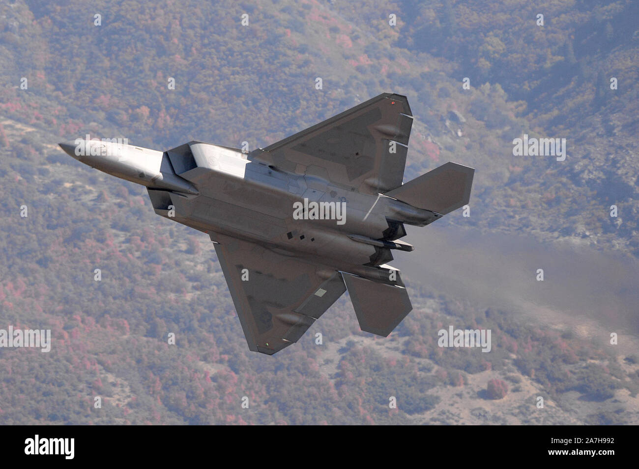 Major Philip “Stonewall” Johnson, 514th Flight Test Squadron, breaks right in F-22 Raptor 037 after a low approach on October 11, at Hill Air Force Base, Utah, upon completion of a functional check flight following an extensive 7-year engineering and repair effort on the aircraft. On May 31, 2012, the aircraft was damaged at Tyndall Air Force Base, Florida, during touch and go pilot training. It was determined that repairing the aircraft was worth the effort due to the limited number of the fifth generation aircraft.  (U.S. Air Force photo by Alex R. Lloyd) Stock Photo