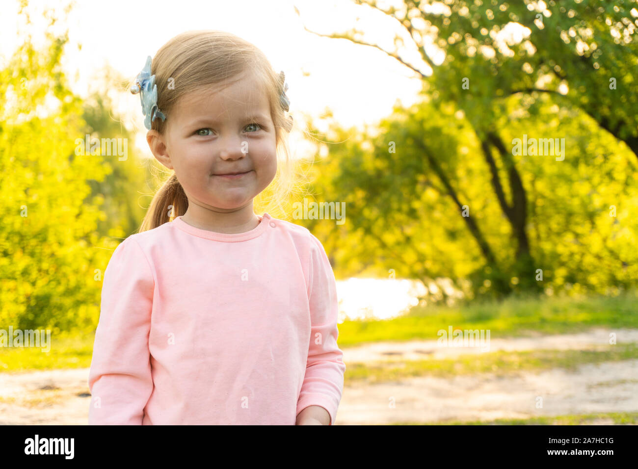 Very cute and adorable little girl looking in camera Stock Photo - Alamy