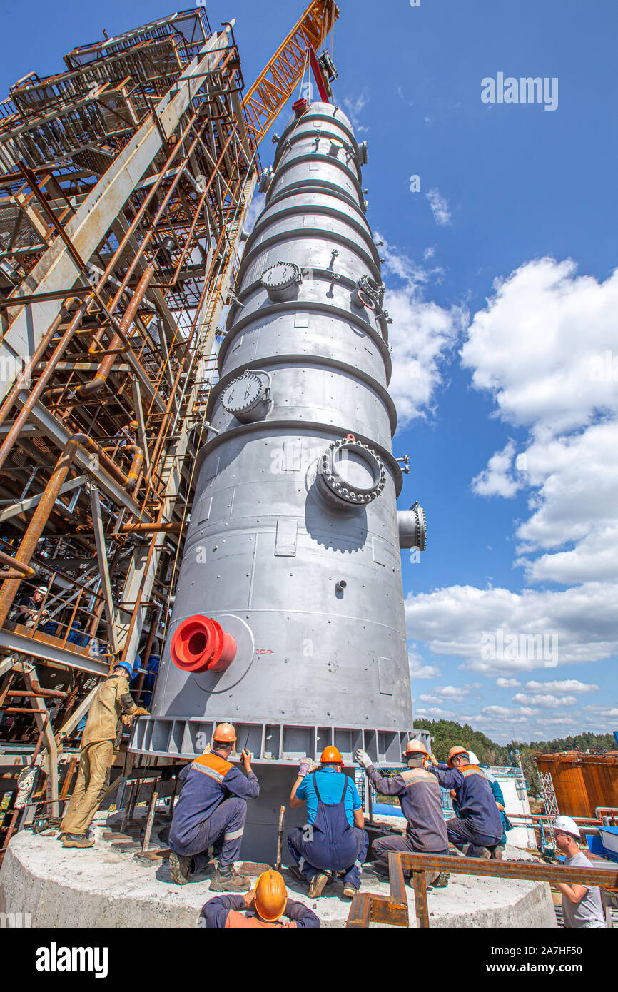 MOSCOW, RUSSIA, 08.2018: Construction of an oil refinery near Moscow. Workers install components of an oil refinery, construction and installation of Stock Photo