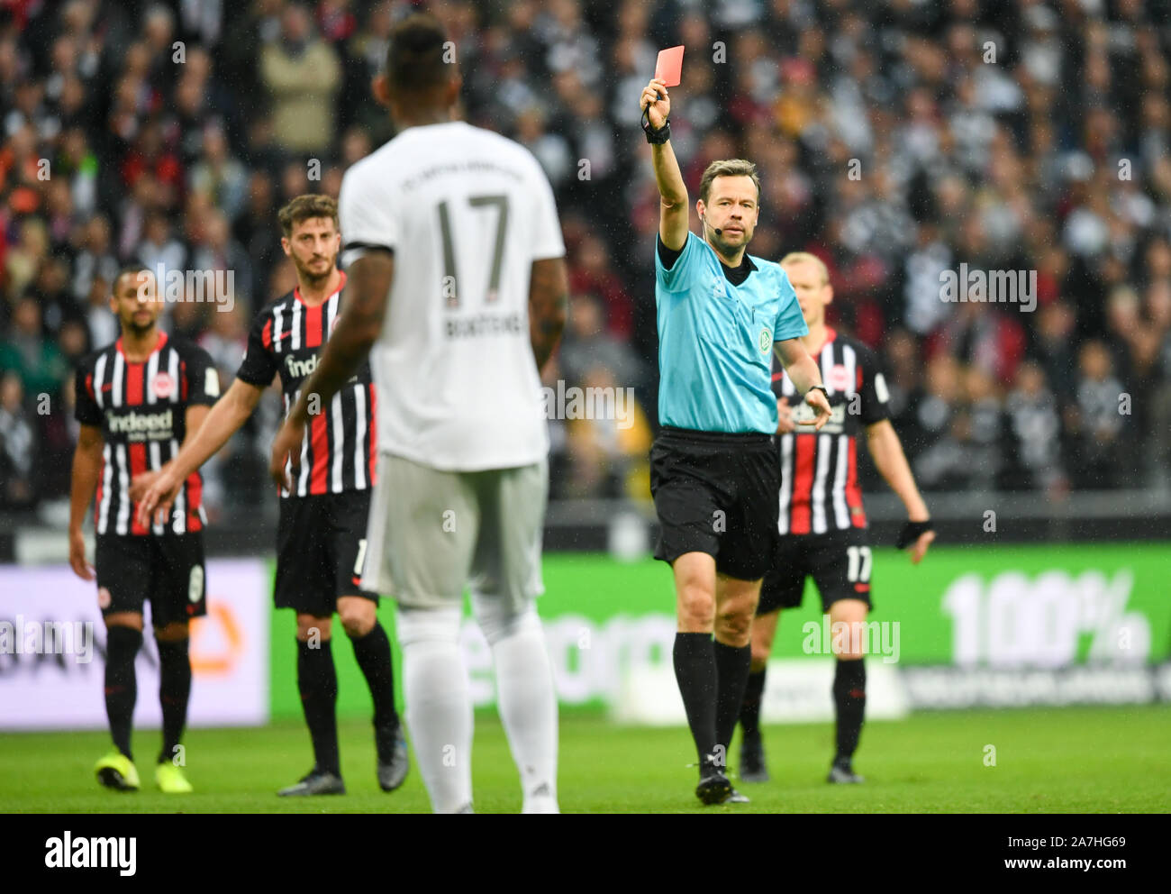 Frankfurt, Germany. 2nd Nov, 2019. Jerome Boateng (Front) of Bayern Munich  is shown a red card by referee Markus Schmidt during a 2019-2020 season  German Bundesliga match against Eintracht Frankfurt in Frankfurt,