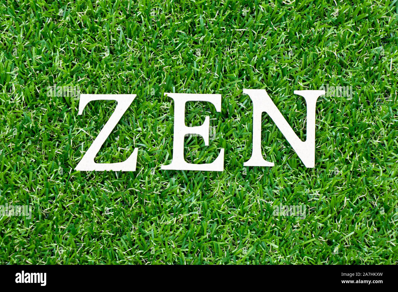 Wood letter in word zen on green grass background Stock Photo Alamy