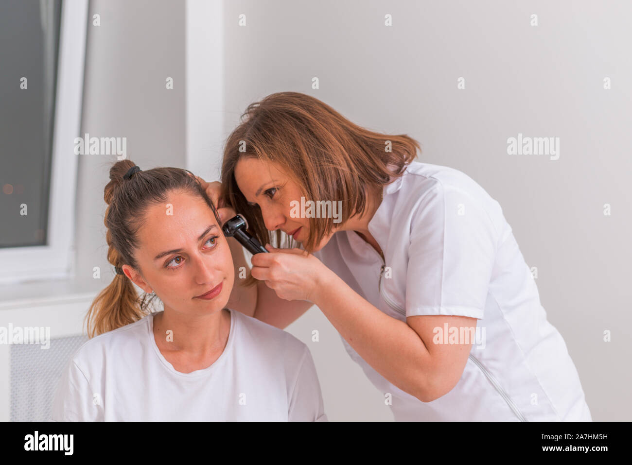 Doctor Examining Teen Girl Doctor Examining Teen Girl