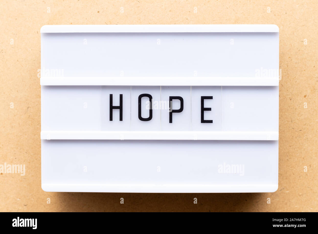 Lightbox with word hope on wood background Stock Photo