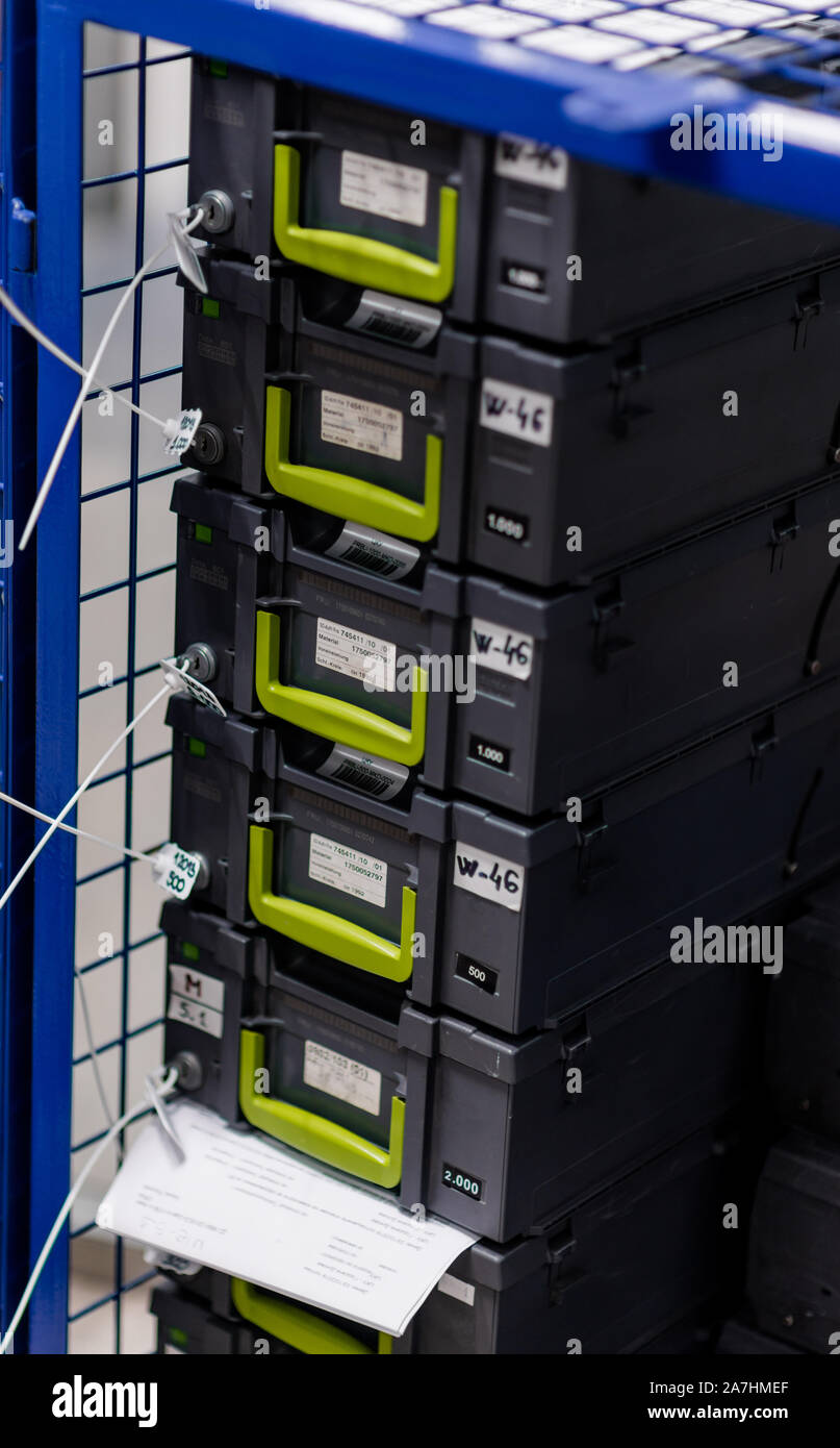 Safety boxes for storing counted banknotes placed inside of blue metal ...
