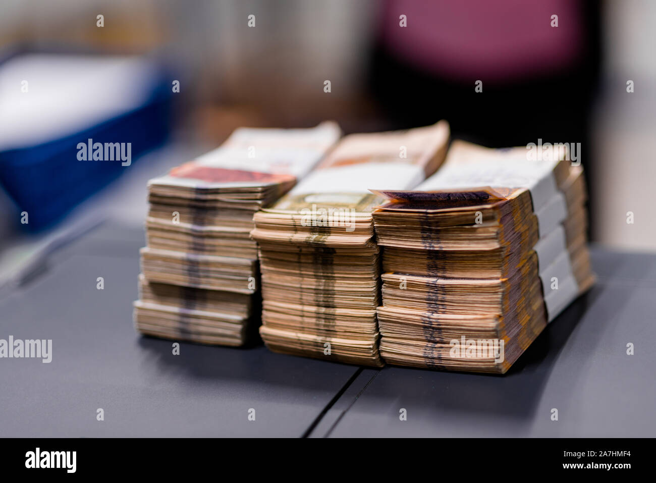 Bundles of banknotes divided into groups with currency straps placed on ...