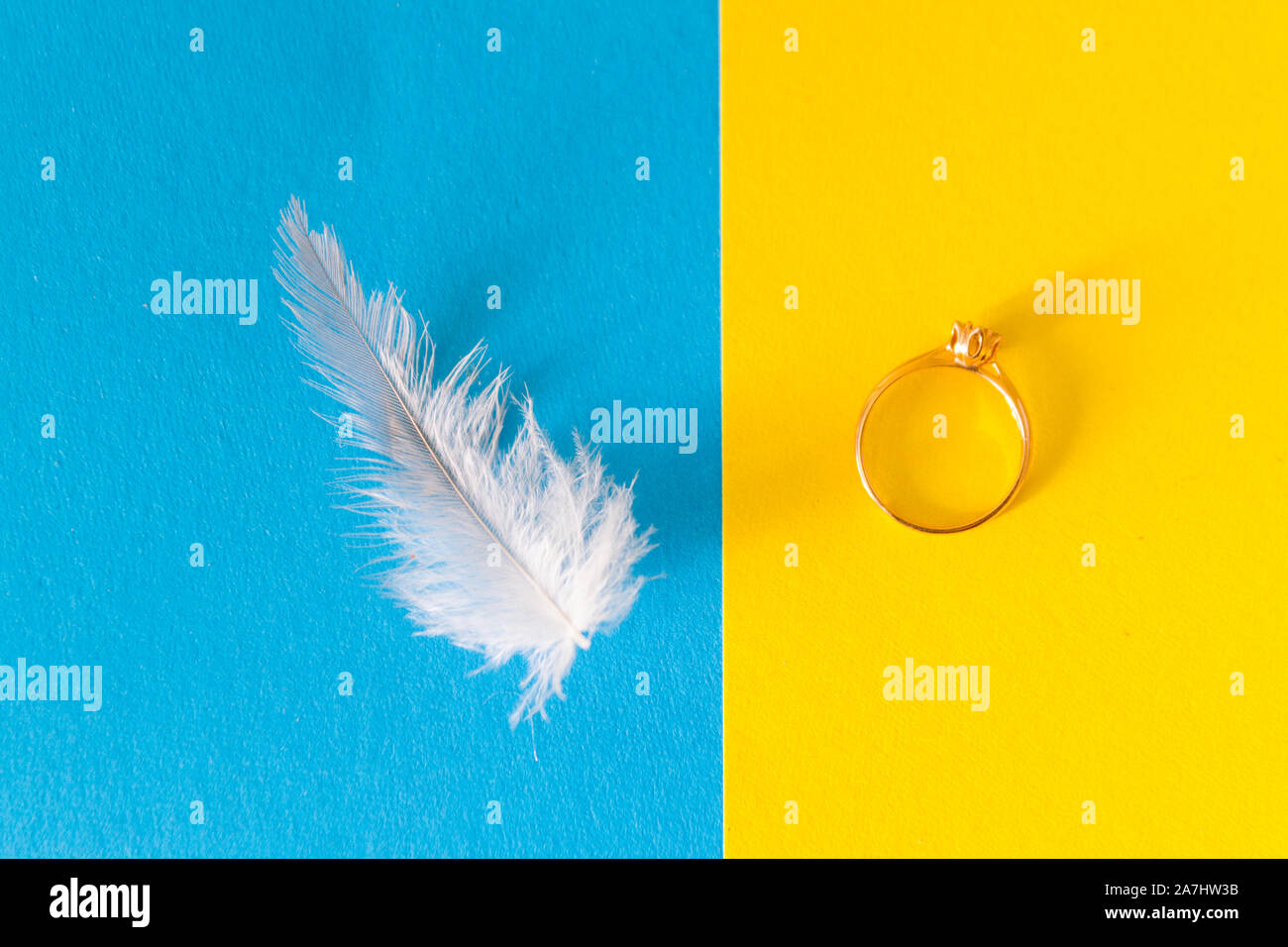 Feather and wedding ring. Love and tenderness concept Stock Photo Alamy