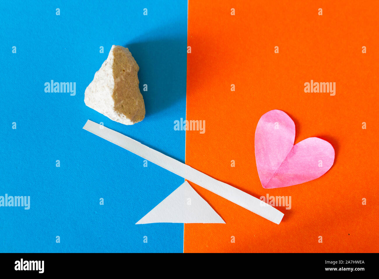 Heart and stone on scale. Love or hate concept Stock Photo - Alamy