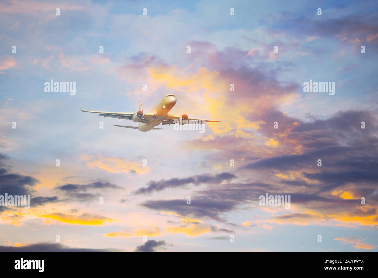 Airplane is flying in the blue sky Stock Photo - Alamy