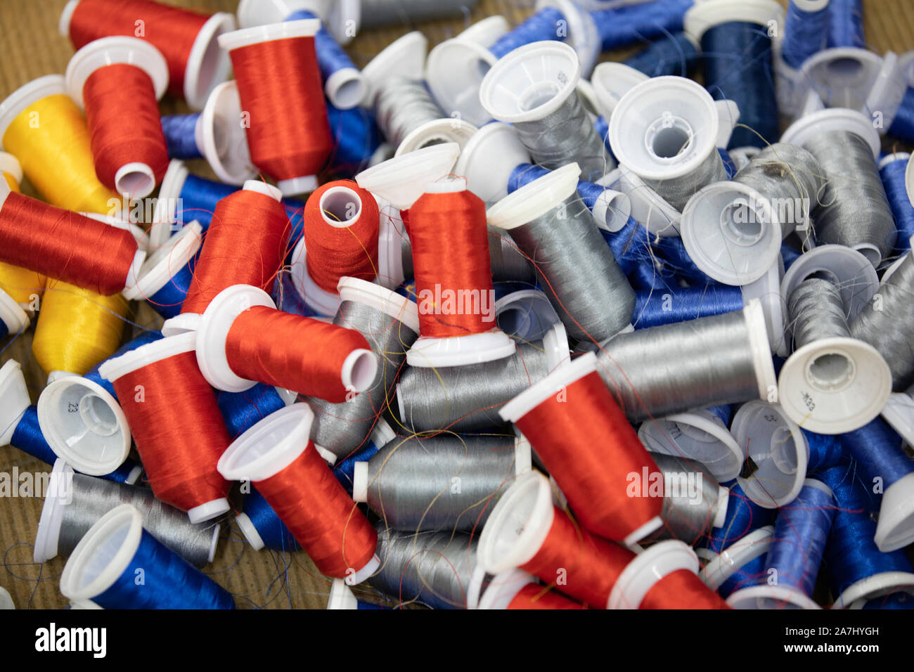 thread roll colorful red yellow blue closeup Stock Photo