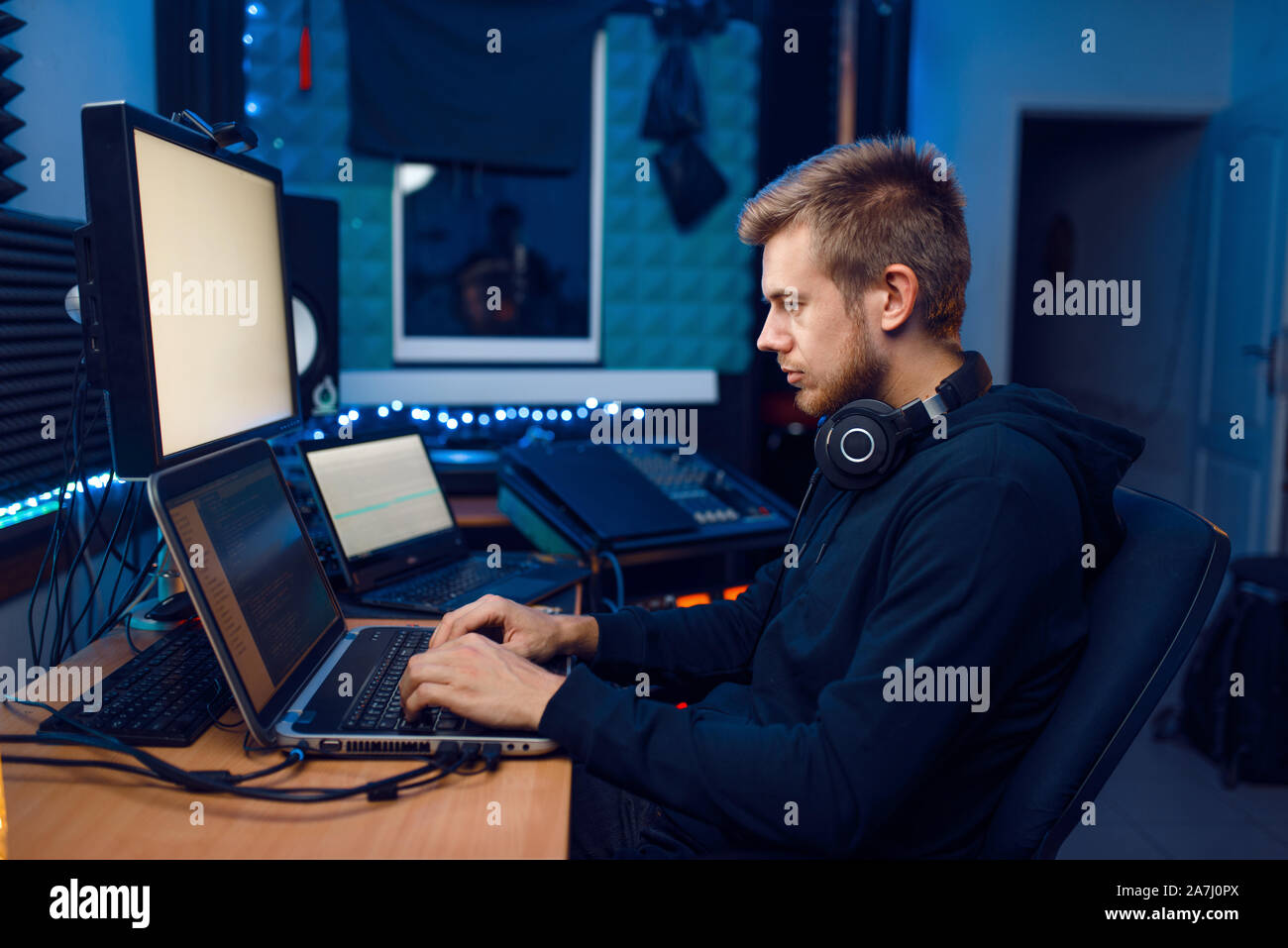 Programmer working on laptop, computer technology Stock Photo