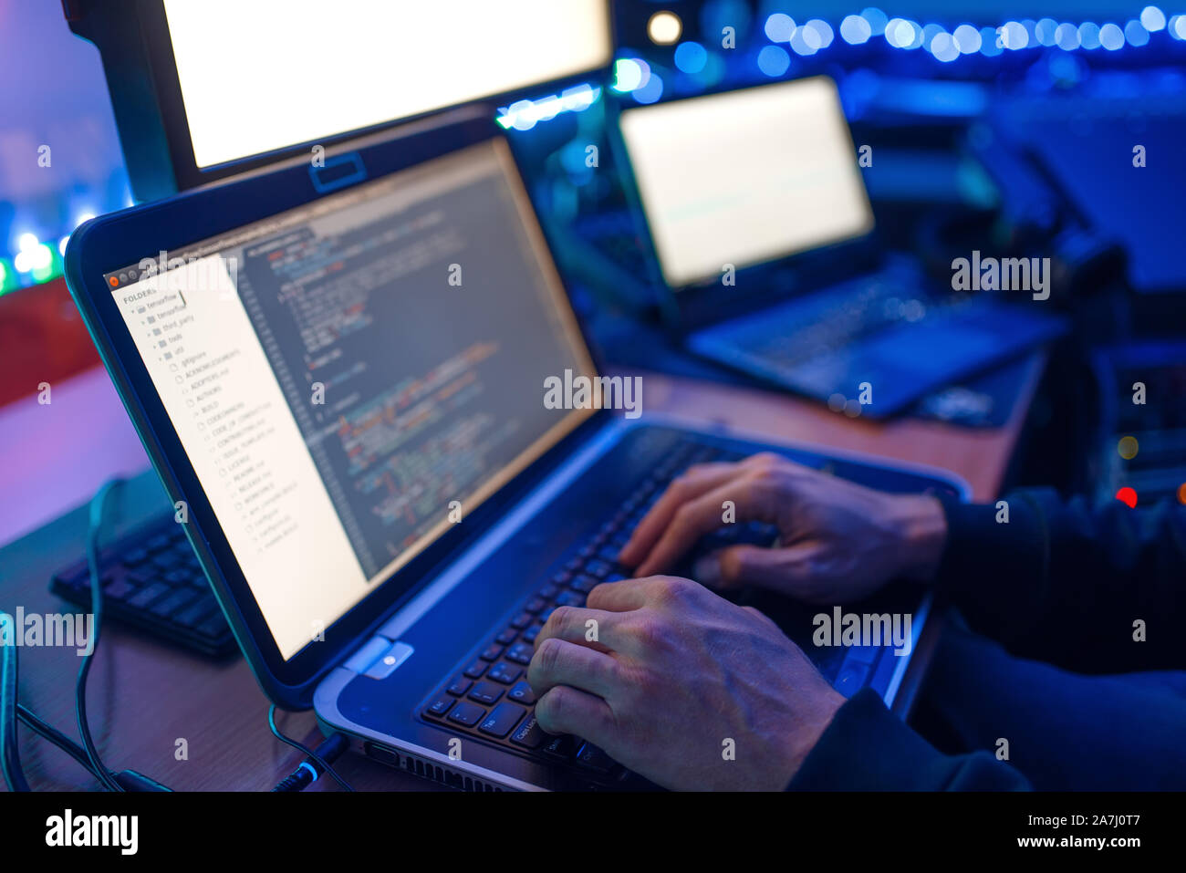 Programmer hands on keyboard, network security Stock Photo