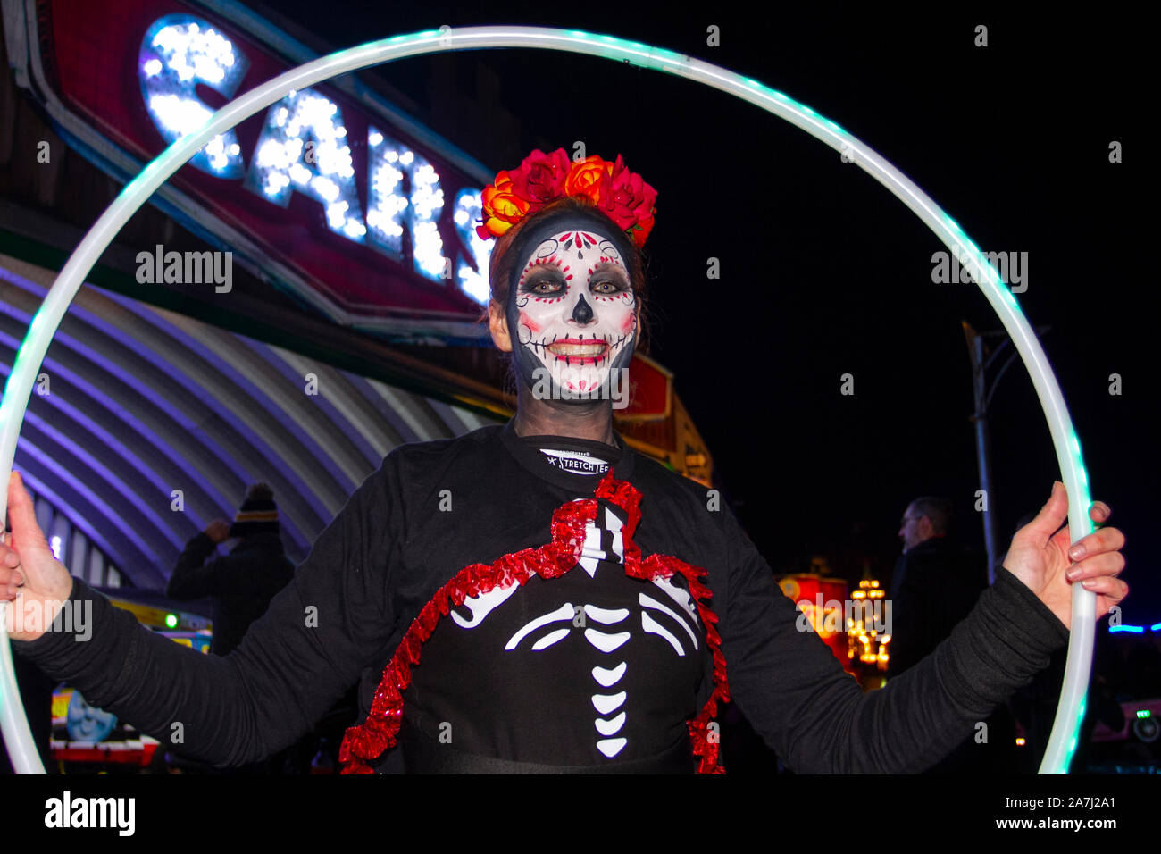 Skull Face Mask Ghost Bones Southport, Merseyside. Nov, 2019. ' Bring on the fire project' display at the Day Of The Dead' Festival – November is the host month to Mexico's Day of the Dead – and Southport Pleasureland staged its own twist on the spooky Mexican celebration with explosive cascade of colours and patterns created while dancing and moving with light and vibrant revelry in a feast for the senses.  A host of fantastic entertainment & celebrations brought thousands of tourists to the resort to enjoy the spectacle. Credit; MediaWorldImages/AlamyLiveNews Stock Photo