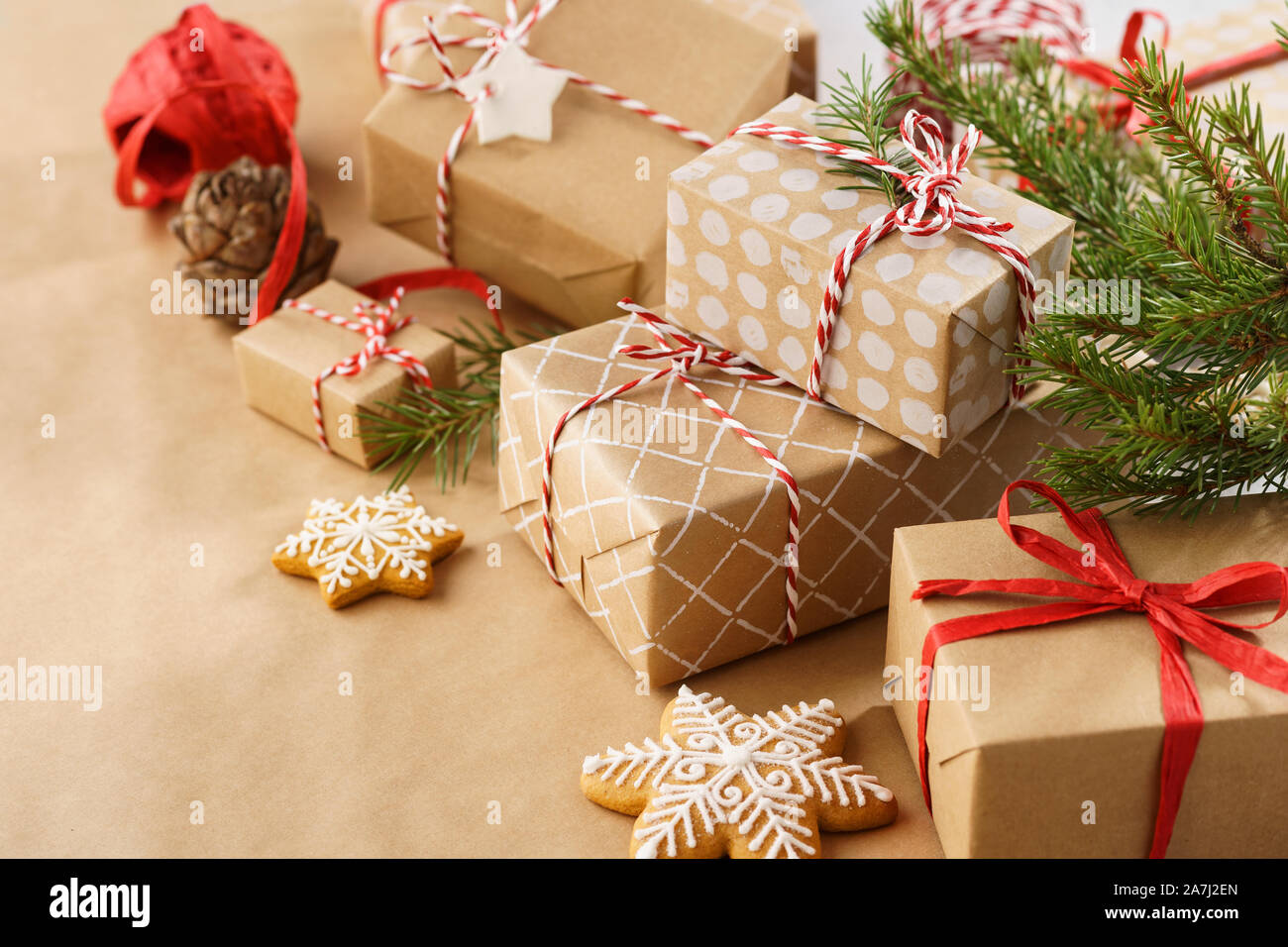 Stack of handcrafted gift boxes and decoration. Christmas or New Year preparation. Stock Photo
