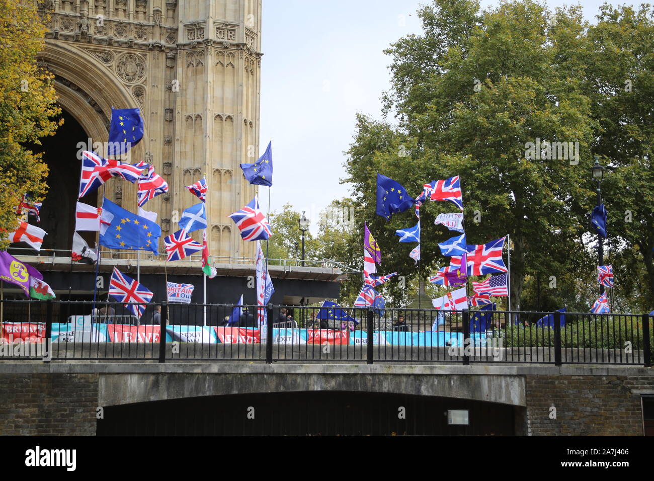 29 October 2019 London pro-Brexit and anti-Brexit flags, banners and campaigners outside the Houses of Parliament, London, UK Stock Photo