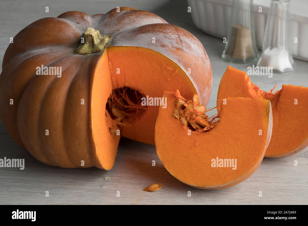 Orange Moschata pumpkin sliced into parts for cooking Stock Photo