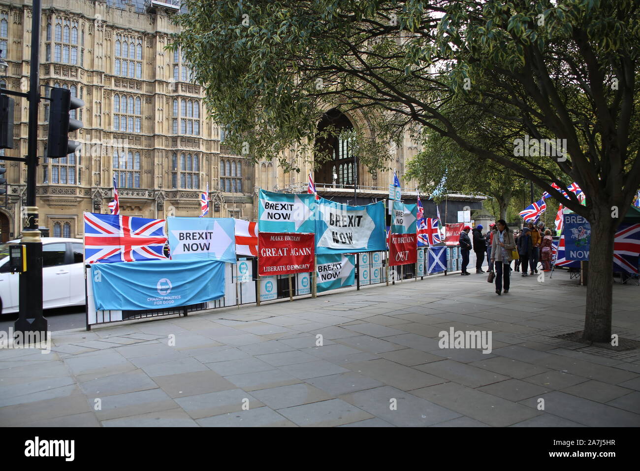 29 October 2019 London pro-Brexit and anti-Brexit flags, banners and campaigners outside the Houses of Parliament, London, UK Stock Photo