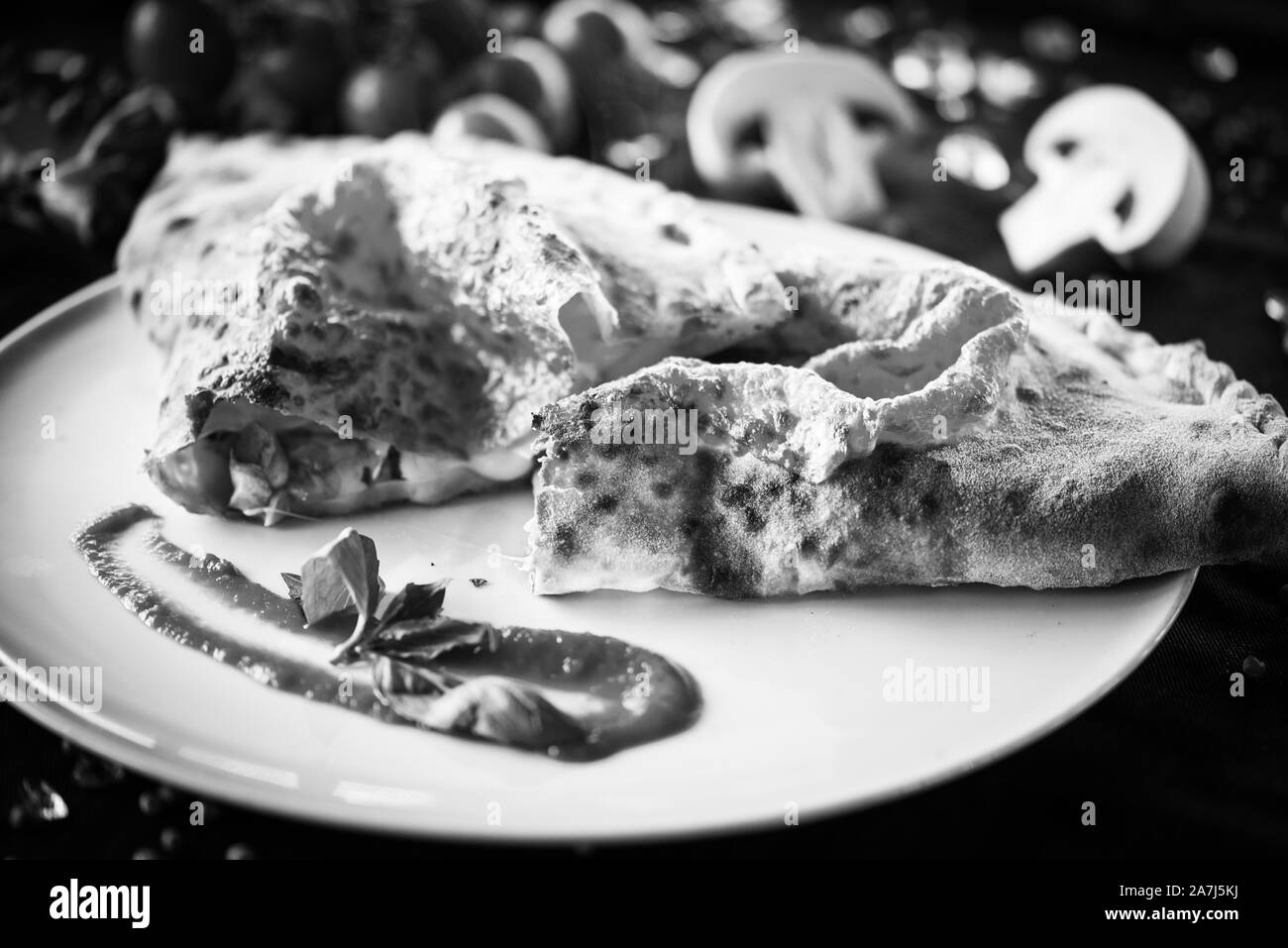 tasty italian calzone pizza dish with fresh ingredients Stock Photo Alamy